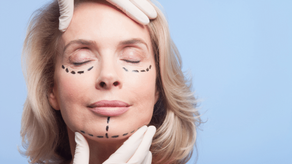 Close up portrait of woman with dotted lines on face